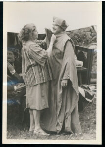 Hazel Robinson adjusting actors costume