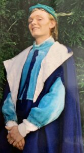 Young man in blue costume